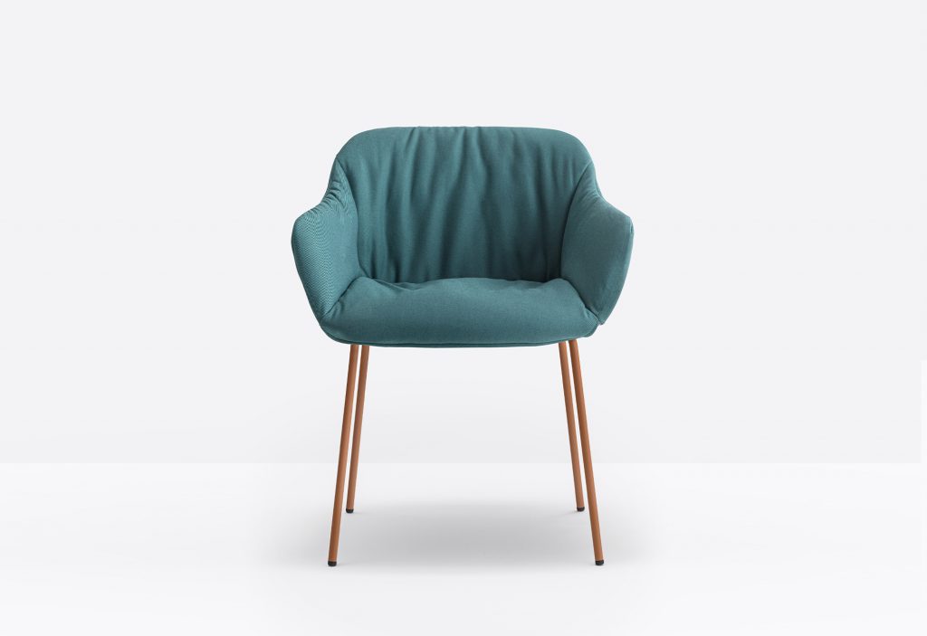 green comfortable armchair with steel legs